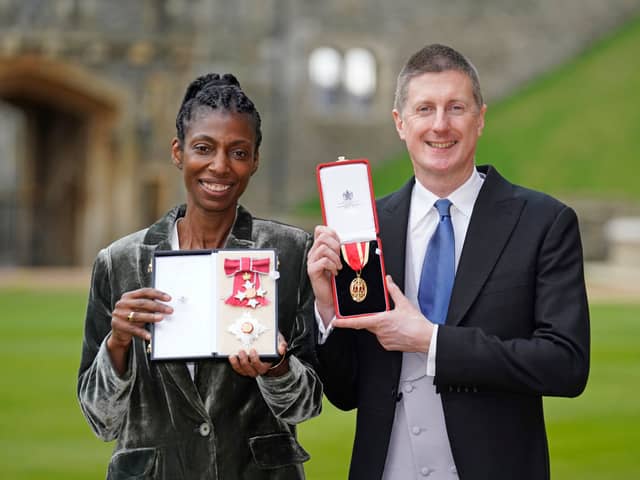 Sharon White poses with her award after she was made a Dame CBE, for public service, next to her husband Sir Robert Chote (Photo by Andrew Matthews - WPA Pool/Getty Images)