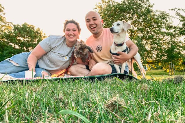 Amy and Wes enjoying the sun with their pets.