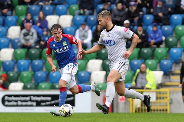 Linfield's Ryan McKay with Adam Salley of Newry City.