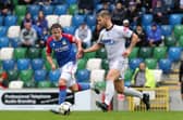 Linfield's Ryan McKay with Adam Salley of Newry City.