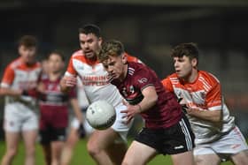 Thomas Davis' Danny Shields with Clann Eireann's Aiden Cassidy and Niall O Neill