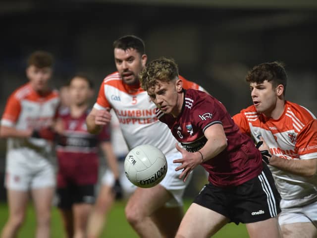Thomas Davis' Danny Shields with Clann Eireann's Aiden Cassidy and Niall O Neill