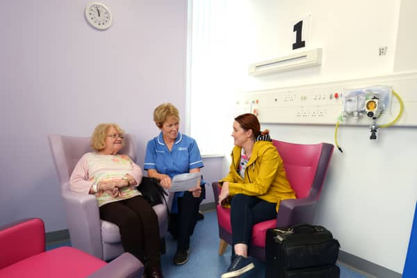 Staff Nurse Bernadette Cunningham with patient Margaret Savage, ready to go home with her daughter Richella Byrne.