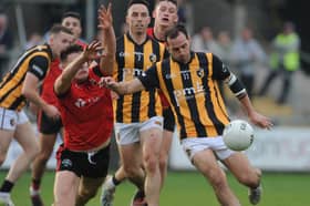 Crossmaglen’s Jamie Clarke shoots as Madden’s Niall Grimley tries to block during the Armagh SFC Semi-final.