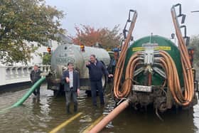 Local Camlough residents came to the rescue after the main road in the village was flooded on Monday morning.