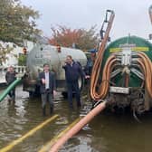 Local Camlough residents came to the rescue after the main road in the village was flooded on Monday morning.