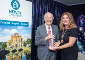 Martin Naughton receives his award from Julie Gibbons, President of Newry Chamber.