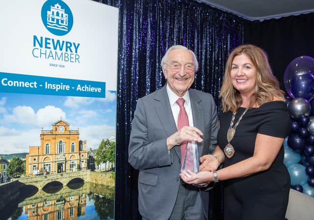 Martin Naughton receives his award from Julie Gibbons, President of Newry Chamber.