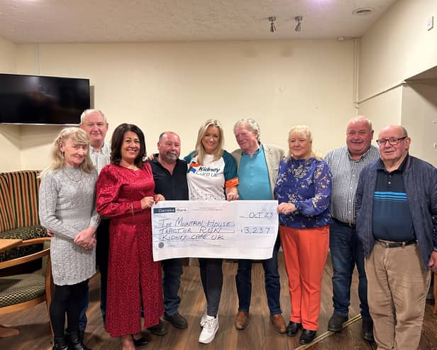The Mountain House Tractor Run Fundraising Committee handing over a cheque for the proceeds of their Tractor Run to Kidney Care UK Northern Ireland Ambassador Jo-Anne Dobson.