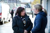 Cllr Valerie Harte talks to business people in Newry following last week's floods.