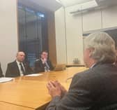 Mickey Brady MP across the table from Chris Heaton-Harris.