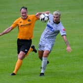 Newry's Adam Salley beats Carrick Rangers defender Albert Watson during the two sides' meeting in August.