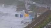 Huge waves and battering winds have washed newly-painted huts on Castle Beach, Falmouth, into the ocean.