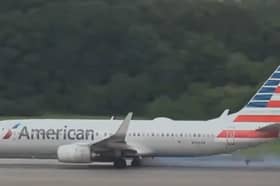 Boeing 737’s tyre explodes, flinging rubber across the runway.