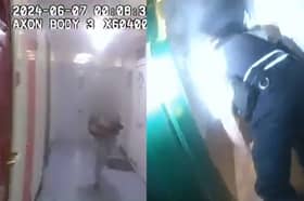 Police crawl into burning flat to rescue residents from fire.