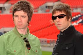 Oasis band members Noel (left) and Liam Gallagher are pictured during a photo call at Wembley Stadium. 