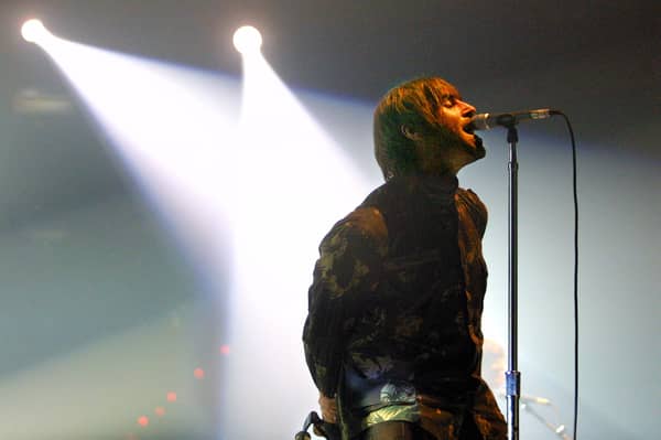 Oasis rock group performs during a concert, late 20 November 2002 in Spain. Photo: RAFA RIVAS/AFP via Getty Images