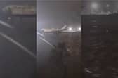 Valencia Airport runway submerged in flood water.