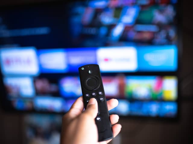 Person using an Amazon Fire TV Stick. Photo: Anna Quelhas - stock.adobe.com