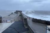 Huge waves crash into Porthcawl pier.