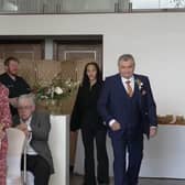 Neil Crossley walks down the aisle at his daughter's wedding, forgetting to take her with him, in Holmfirth, Yorkshire.