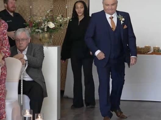 Neil Crossley walks down the aisle at his daughter's wedding, forgetting to take her with him, in Holmfirth, Yorkshire.