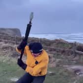 Video taken by the weather tracking group shows their team member battling against the strong winds while attempting to measure the wind speed. 