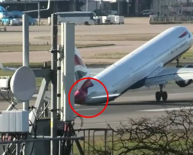 Tail of British Airways jet hits runway during aborted landing.