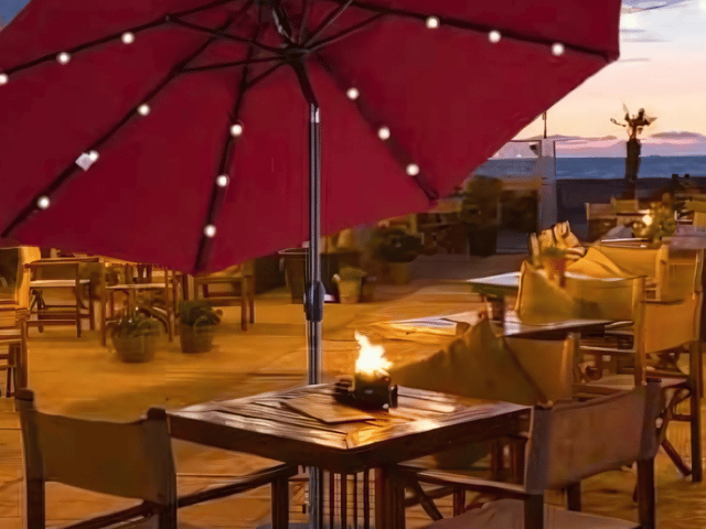 The Outsunny parasol with solar-powered LED lights creates a cosy and inviting glow for evening gatherings