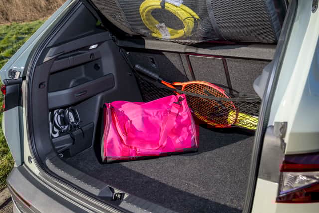 There's lots of classic clever Skoda touches - like the innovative net for storing the charging cable