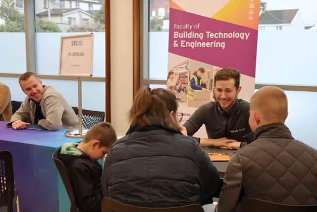 Attendees at the Newry campus receiving information from course lecturers.