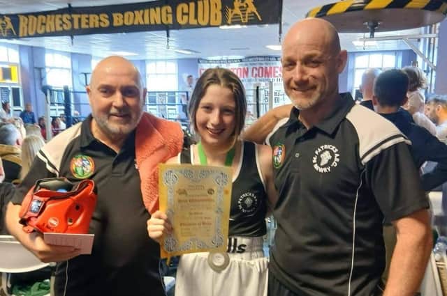 Gold medal winner Amy McManus pictured with her coaches.