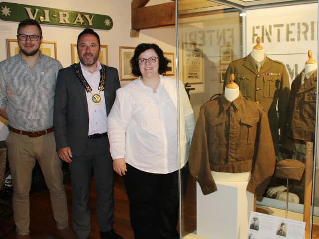 Newry, Mourne and Down District Council Chairperson, Councillor Pete Byrne with Alan Freeburn, Museum and Heritage Services Manager and Joanne Cummins, Collections Officer attending the launch of a new exhibition at Newry, Mourne and Down Museum to mark the 80th Anniversary of the D-Day landings.