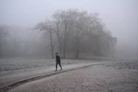 Person runs in frosty weather.