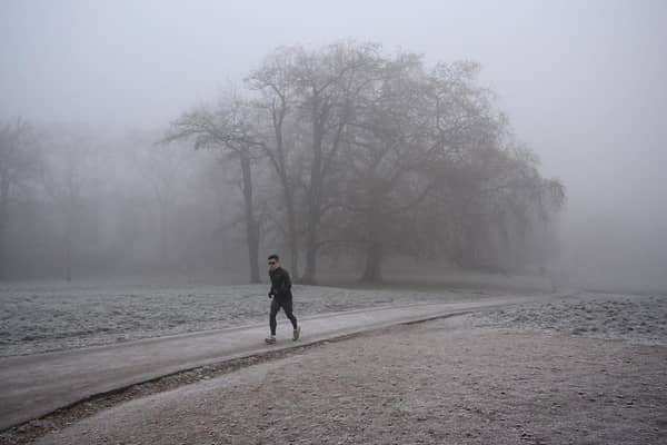 Person runs in frosty weather.