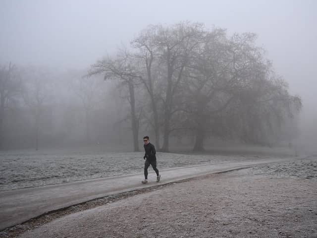 Person runs in frosty weather.