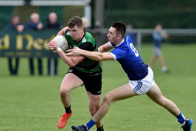 Killeavy's Cathal Boylan and Clan na Gael's Shane McPartlan pictured during their 2022 Championship meeting. Pic: John Merry