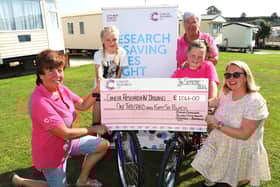 Emma Cordner (second right) with mum Kim and best friend Jasmine O'Neill hand over the cheque for £1046 to Rosalind McCullough and Hilary Ferris of Newry Cancer Research.  INNR3845