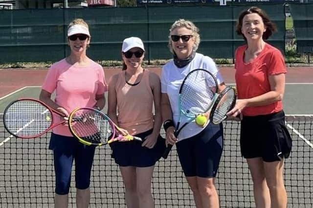 Competitors taking part in the Warrenpoint Tennis Doubles Tournament .