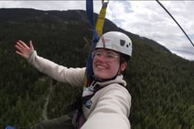 Róise McQuaid on a zipline as she tries to conquer her fear of heights to raise funds for DKMS - the charity which helped support Daniel Greer during his search for a stem cell transplant match.