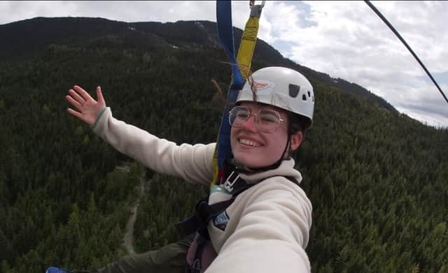 Róise McQuaid on a zipline as she tries to conquer her fear of heights to raise funds for DKMS - the charity which helped support Daniel Greer during his search for a stem cell transplant match.