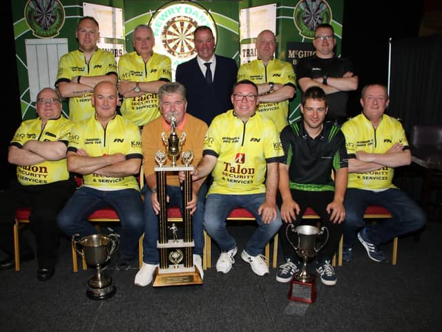 McGuigan's A team with Gerard McGuigan on stage accepts the Tom Haughey Cup, sponsored by Trainor's Bar. Pictures: Liz Boyle