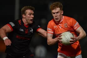 Armagh's Conor Turbitt goes on the attack against Louth's Conor Grimes on Saturday evening.