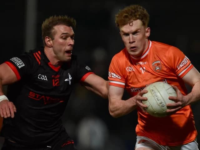 Armagh's Conor Turbitt goes on the attack against Louth's Conor Grimes on Saturday evening.