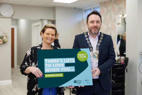 NMDDC Chairperson, Cllr Pete Byrne launches the new Make It Local campaign, ‘There’s Lots to Love when you #ShopLocal’. The Chairperson is photographed with Michelle Mallon from Michelle Mallon Hair & Beauty in Meigh, one of the villages and small towns which benefited from improvements to its infrastructure and public spaces through funding from the ‘Small Settlements Regeneration Programme’