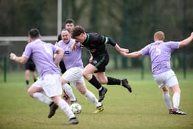 Camlough captain John Taylor skips through the Ballyholland defense on Saturday.