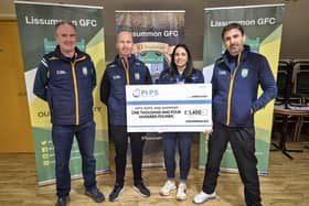 Members of Lissummon GAC present a cheque to PIPS Hope and Support.