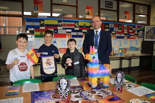 Rian, Charlie and Keelan visit the Spanish Department and speak with teacher Kevin Boyle at St. Colman's College Open Day. INNR0544