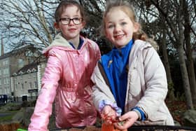 Matylda Maginn (left) and Aisling Nic Mhathúna from Bunscoil an Iúir check out the new temporary community space in the Newry City Park site, opened following funding by the Department for Communities.