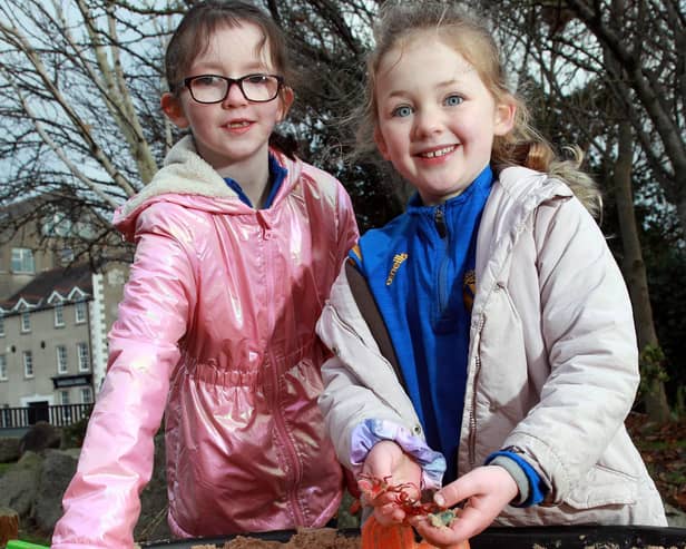 Matylda Maginn (left) and Aisling Nic Mhathúna from Bunscoil an Iúir check out the new temporary community space in the Newry City Park site, opened following funding by the Department for Communities.